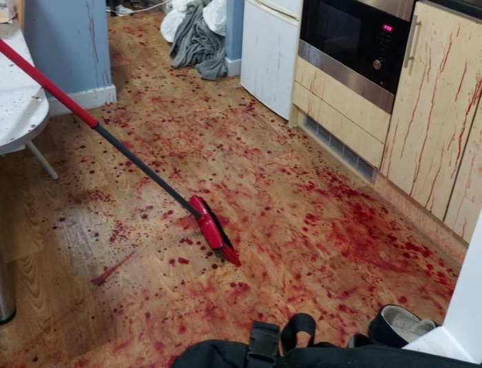Kitchen floor covered in blood